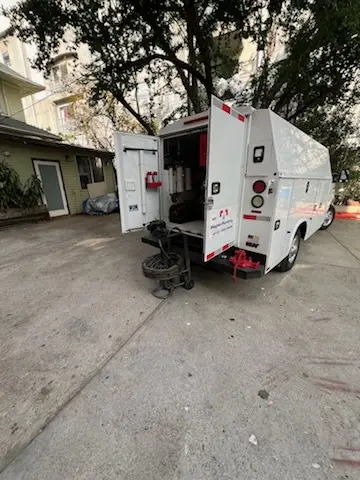 Magnet Plumbing service vehicle on-site for Grease Trap Cleaning in Harmarc Estates